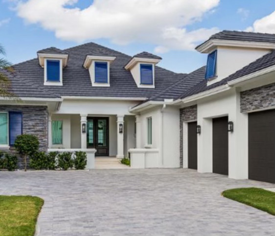 White house with brown garage